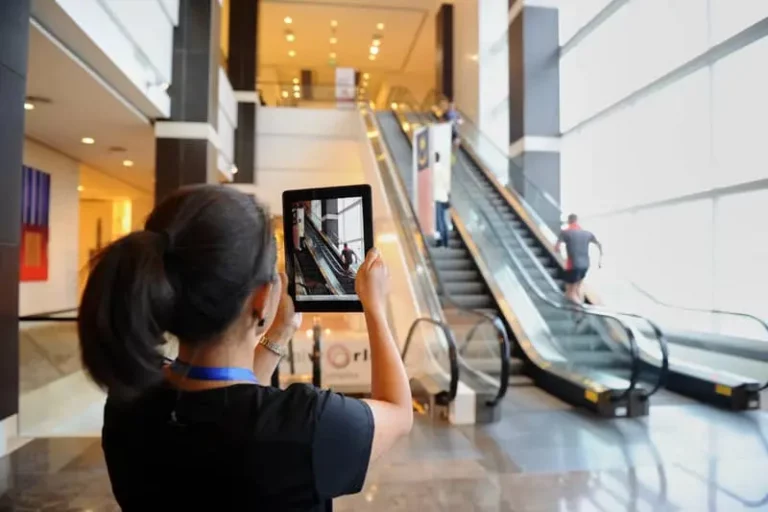 Woman uses iPad to make a movie in a team building corporate event
